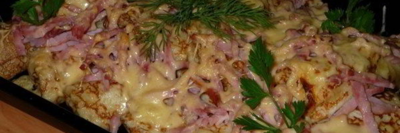 Фаршированные блины под сыром в духовке