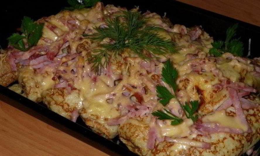 Рецепт фаршированных блинов под сыром в духовке