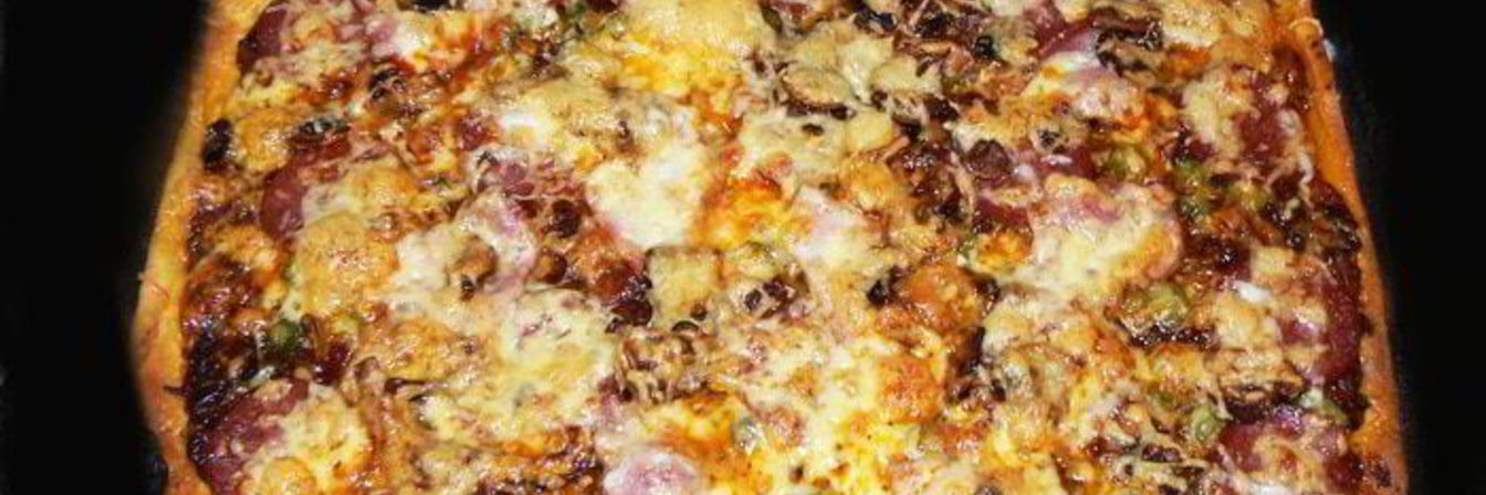 Пицца с копченостями